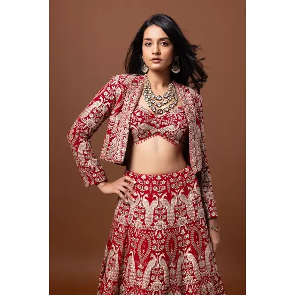 SEASONS-RED CLASSIC BRIDAL LEHENGA SET WITH ALL OVER PATTERNED THREAD WORK PAIRED WITH A MATCHING CROPPED JACKET AND SEQUIN DETAILS.