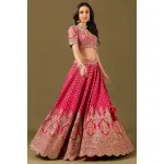 SEASONS-RANI PINK CLASSIC BRIDAL LEHENGA SET WITH ALL OVER PATTERNED HAND EMBROIDERY PAIRED WITH A MATCHING DUPATTA AND FLORAL EMBROIDERED DETAILS.